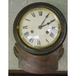 A late 19thC mahogany cased drop dial clock with foliate carved ornament and a turned surround;