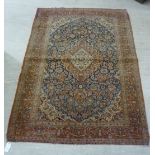An early 20thC Kashan rug,