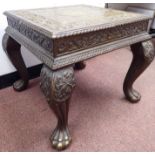 A late 19thC Colonial profusely floral and foliate carved hardwood table stool,