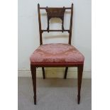 An Edwardian satinwood inlaid rosewood framed salon chair with a marquetry panelled back,