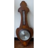 An Edwardian satinwood and ebony string inlaid mahogany backed onion topped banjo shaped aneroid