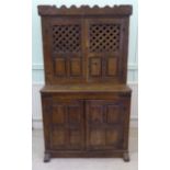 A late 17thC Spanish rustically constructed, lockable, panelled oak cupboard with iron fittings,