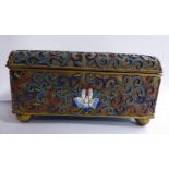 An early 20thC gilt metal and cloisonne box with straight sides and a hinged lid, on ball feet,