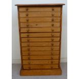 A late 19thC pine collector's chest, the top with a moulded cornice,
