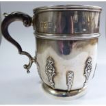 A late Victorian silver Christening cup with applied wire and uniformly cast ornament,