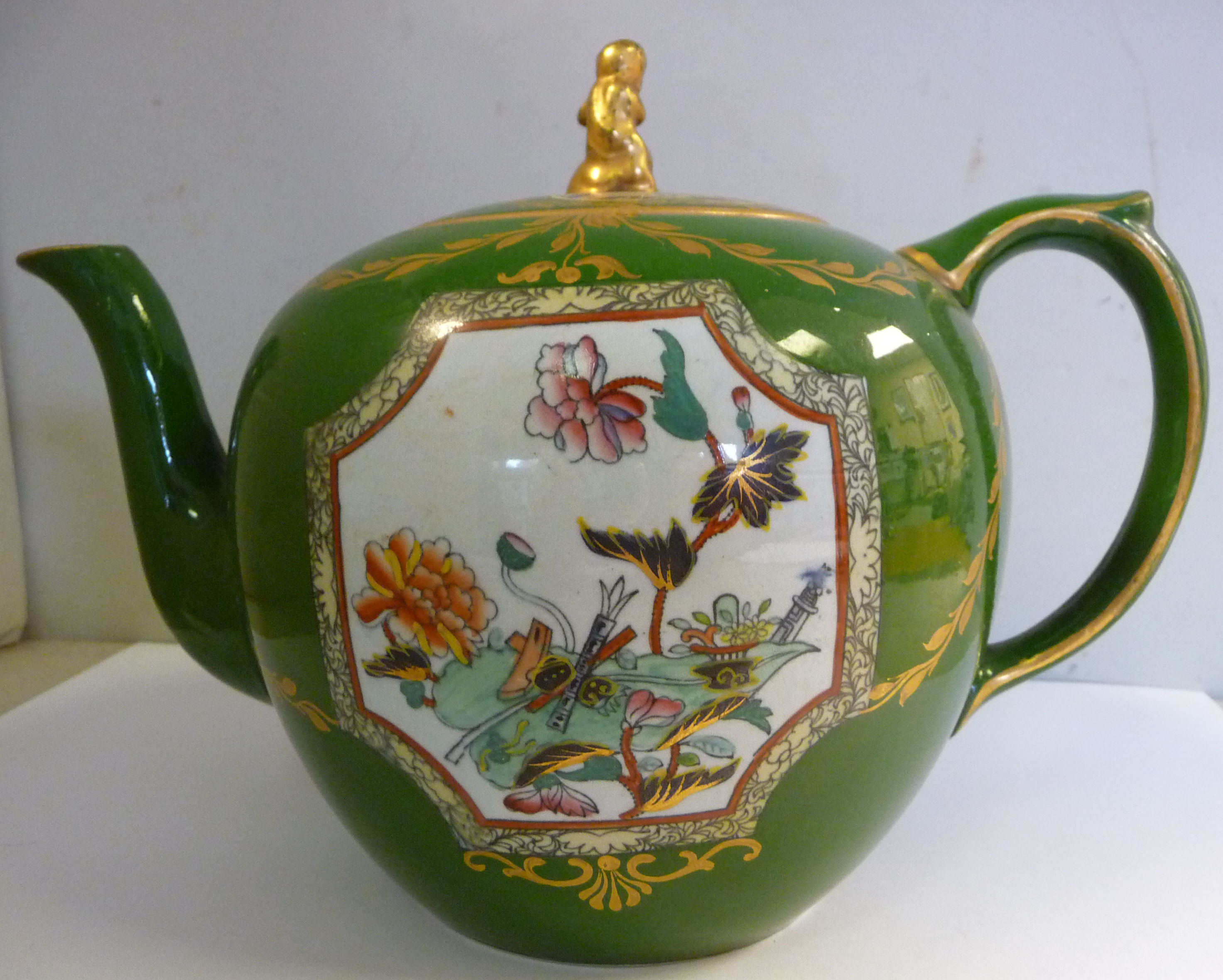 A mid 19thC Ashworth sage green glazed Ironstone china ovoid shaped teapot and lid,