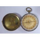A late Victorian lacquered brass cased pocket compass, the hinged cover with engraved information,