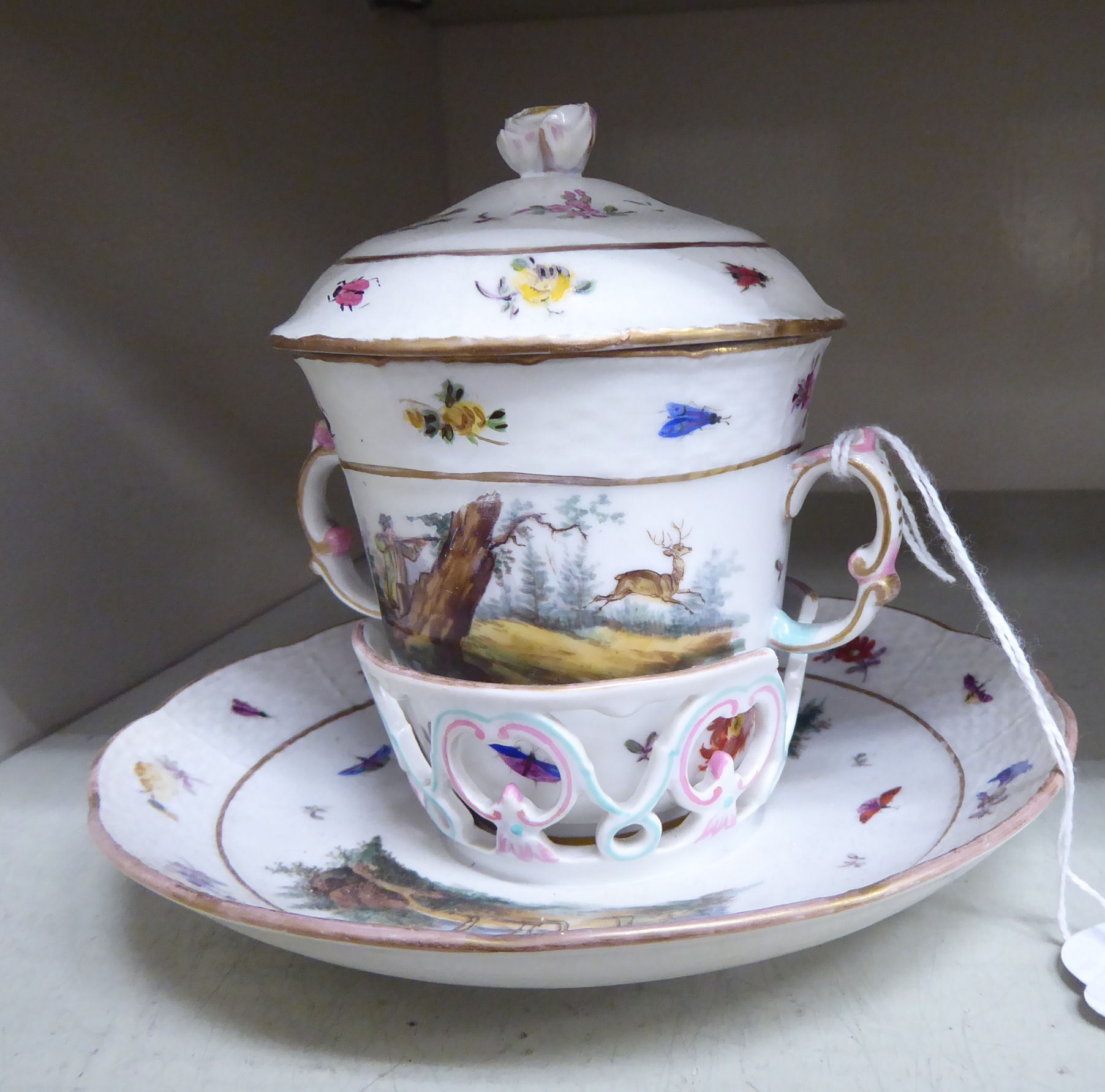 A late 18thC Berlin porcelain covered, twin handled chocolate cup and cover,