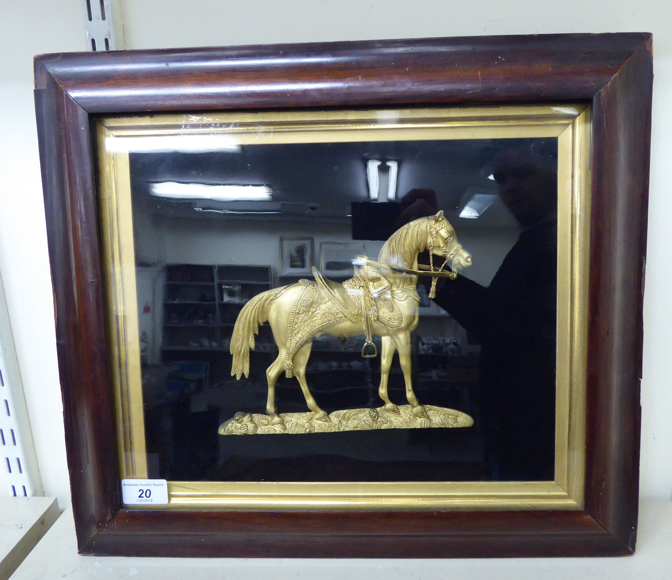 A mid/late 19thC Continental cast gilt metal plaque, a saddled, standing horse,