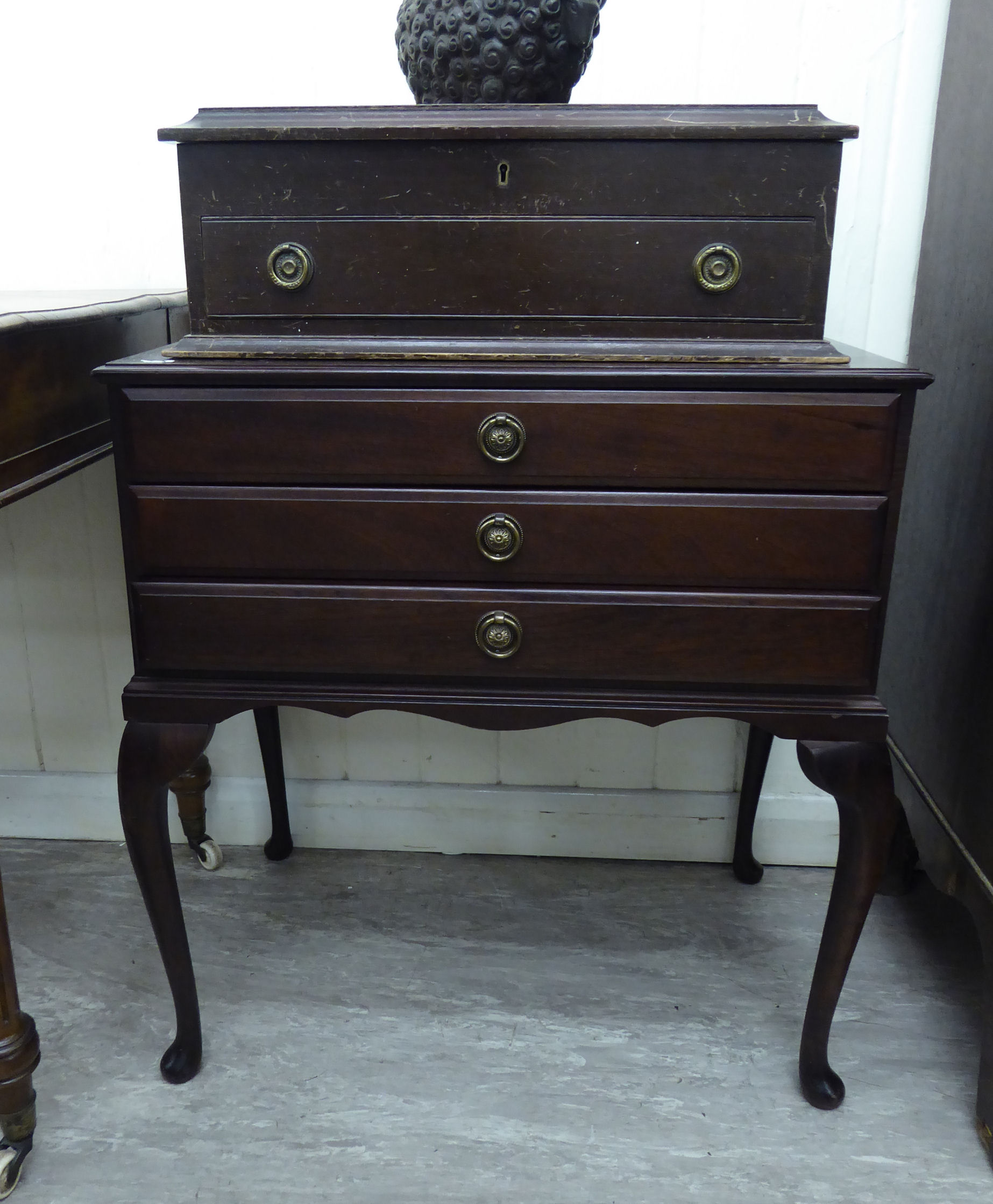 A modern mahogany finished three drawer canteen,