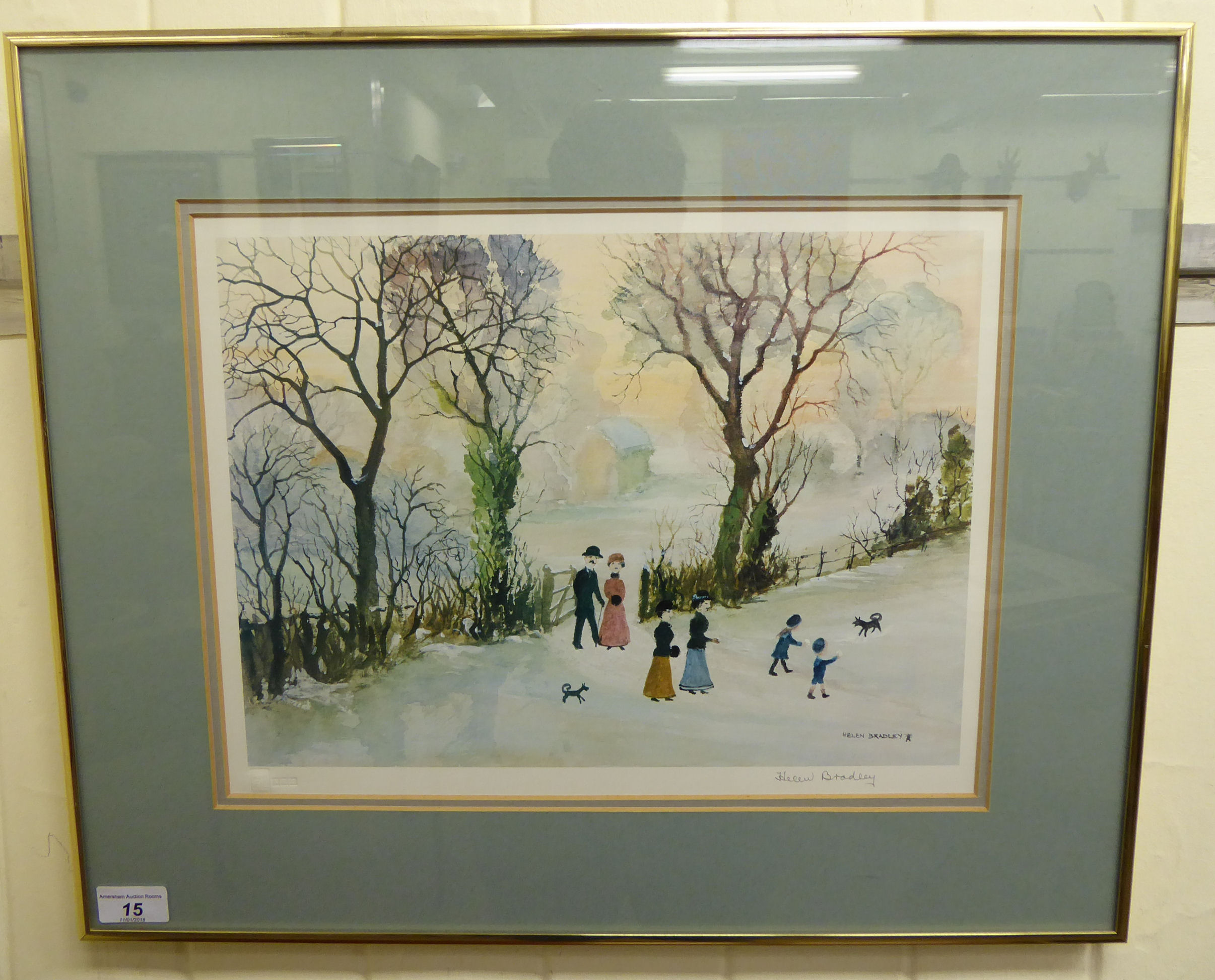 Helen Bradley - a winter scene with a family and two dogs in a field coloured print bears a