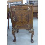 A modern French inspired crossbanded and flame mahogany finished bedside cabinet with a low gallery