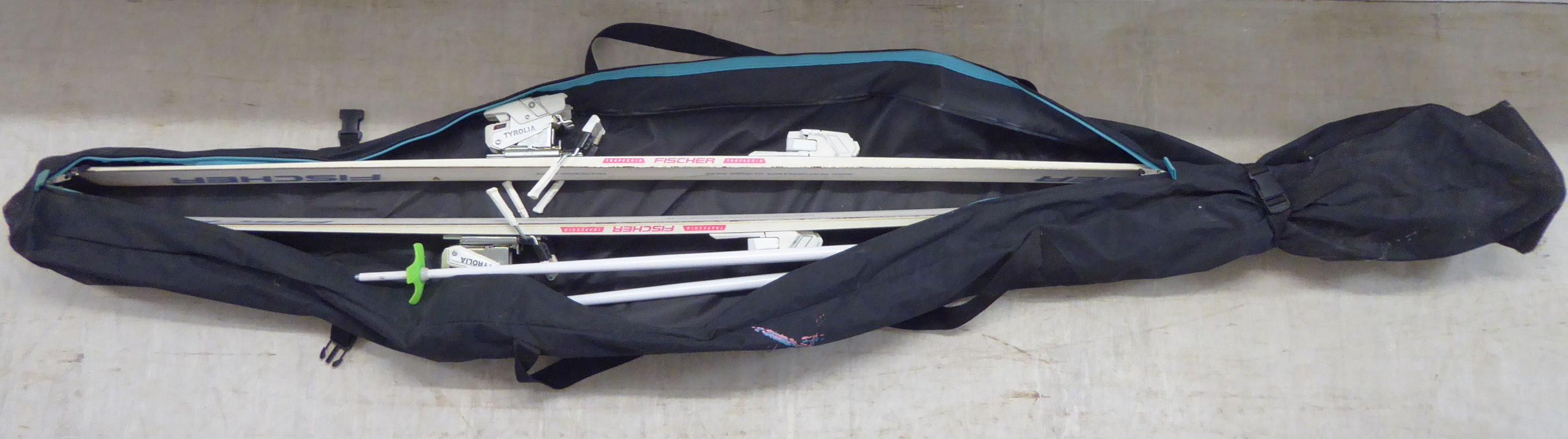 A pair of Fischer Trapezoid Kevlar SC4 snow skis and poles BSR