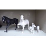 Three ivory coloured glazed china model horses 3-4''h;