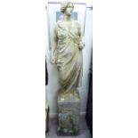 A composition stone garden statue, a Roman woman, carrying fruit,