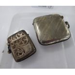 A silver vesta case with a hinged cap, strike plate and pendant ring; and another,
