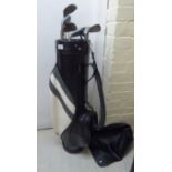 A set of eight Tour Model steel shaft golf clubs,