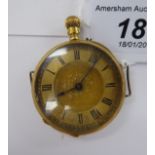 An early 20thC lady's engraved gold coloured metal cased fob/wristwatch,