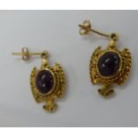 A pair of 9ct gold and garnet set pendant earrings 11