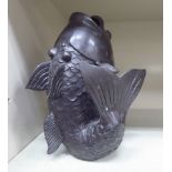 A 20thC Oriental cast and patinated bronze fish vase 7''h OS2