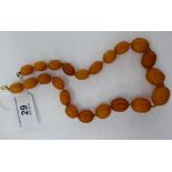 A late Victorian graduated amber bead necklace (approx.