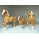 Three Beswick china horses, viz. a stallion 6''h; a mare 6.5''h; and a foal 4.