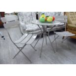 A modern patio set comprising a grey painted metal table,