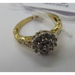 A 9ct gold claw set diamond cluster ring 11