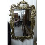 A modern Rococo design mirror,