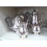 An Asprey silver plated four piece tea set comprising a teapot, coffee pot,