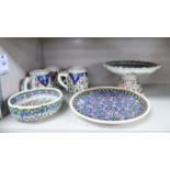 Artisan earthenware domestic items, decorated in Persian inspired designs: to include a tazza,