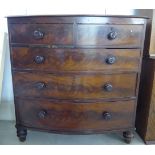 A mid 19thC mahogany bow front dressing chest with two short/three long drawers,