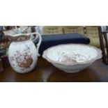 A Doulton' Florida Burslem cream glazed china wash bowl and matching ewer,