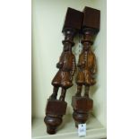 A pair of early 20thC carved oak pillars,