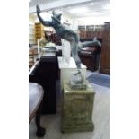 A lead finished garden statue 'Mercury' standing on a ball,