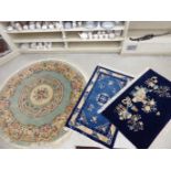 Three Chinese wash rugs: to include one on a dark blue ground 33'' x 58'' S