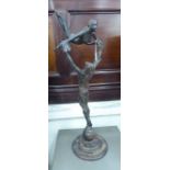 A modern cast and patinated bronze group, a male and female ballet dancer,