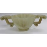 A modern carved jade libation cup with opposing C-scroll handles and engraved ornament 3''dia