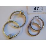 Two pairs of silver hoop earrings 11