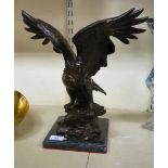 A modern cast and patinated bronze model eagle,