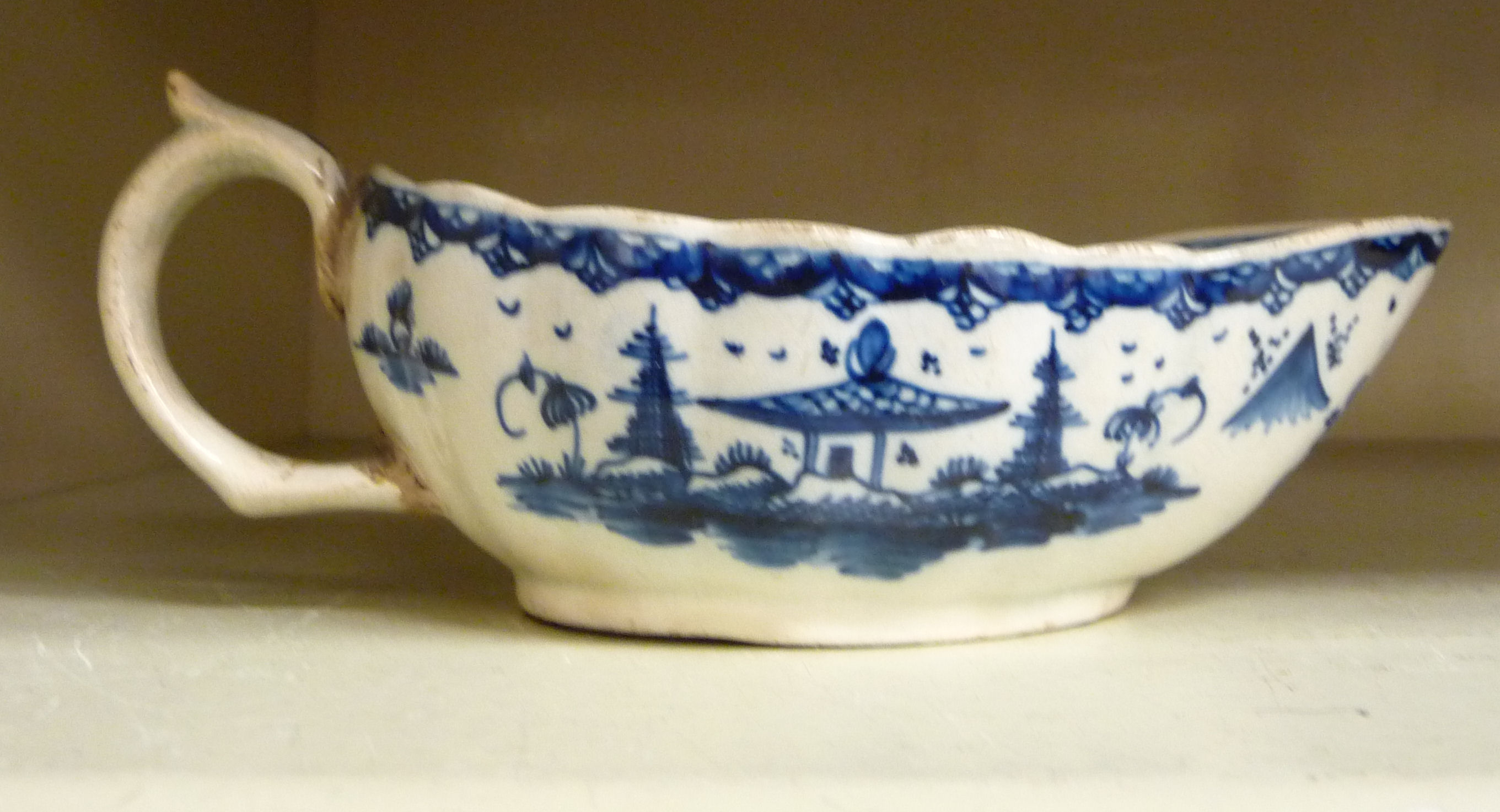 An early 19thC pearlware sauce boat,