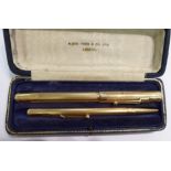 A Swan Mabie Todd rolled gold fountain pen and Fyne Poynt rolled gold pencil,