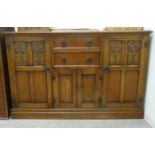 A modern Gothic inspired stained oak sideboard with two central drawers/two small doors,