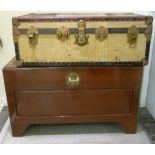 A 20thC Chinese camphor wood chest with a hinged, panelled lid and front,