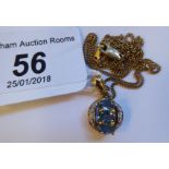 A 9ct gold, blue topaz and diamond set pendant,