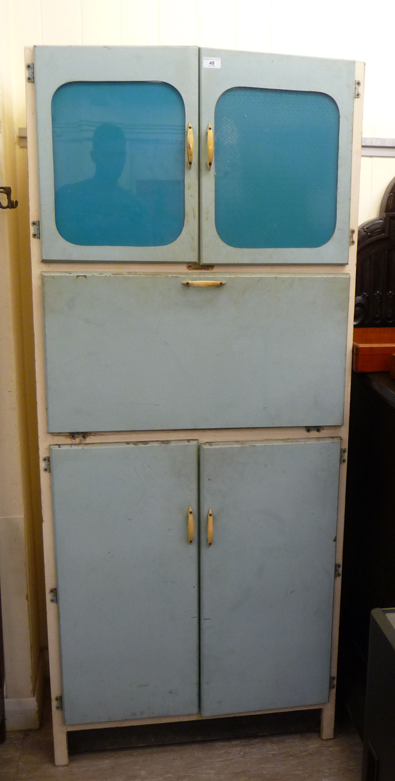 A 1950s blue painted wooden kitchen cabinet,