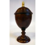 A 19thC treen turned ovoid shaped goblet cup and cover, on a ring knopped pedestal foot 5.