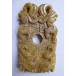 A late 19thC Chinese carved light brown jade tablet with a small central round aperture,