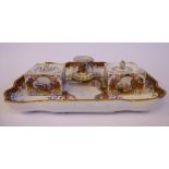 A late 19thC Meissen porcelain desk set, decorated with vignette shoreline scenes,