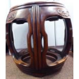 An early 20thC Chinese open framed, moulded mahogany barrel design jardiniere stand,